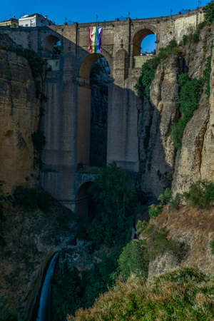 new bridge of ronda with the lgtbi flag on gay pride dayの写真素材