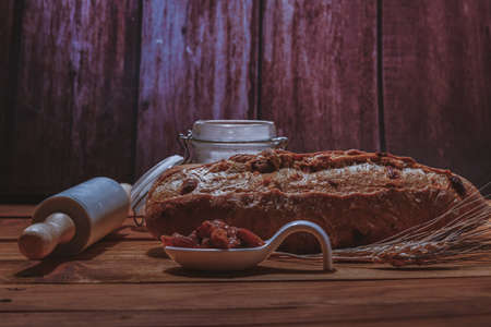 artisan sourdough raisin bread with natural sourdough on a wooden base