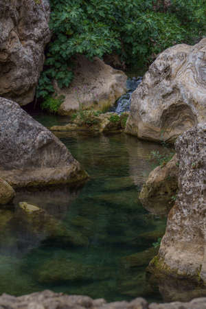swimming pools with a small waterfall in a mountain river with cold and crystalline waters.の写真素材