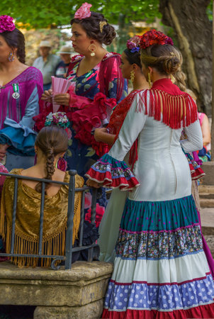 08/31/2022 Ronda,Malaga,Andalucia,Spain meeting of women at the fair of ronda in the alameda with traditional dress of andaluciaのeditorial素材