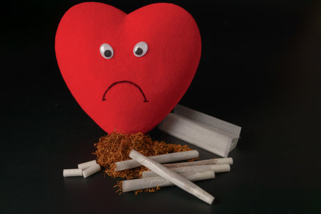 sad heart with cigarettes and tobacco concept of unhealthy habitsの写真素材