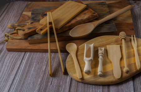 different types of wooden utensils used in the kitchen, boards and cutlery