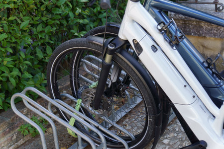 electric bicycles parked and locked with a padlockの写真素材