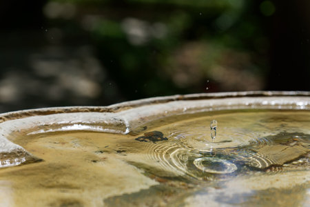 drop of water falling in a public fountain splash effect