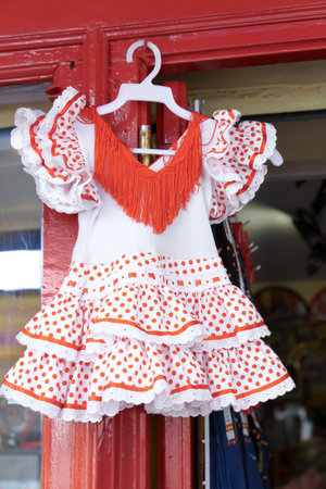 red and white gypsy dress for girls in the window of a store windowの写真素材