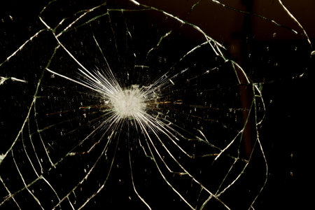 close-up of a broken mirror with a black background and copy spaceの写真素材