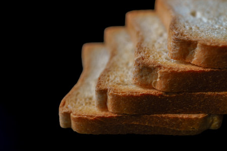 Close-up of toasted bread slices creating a delicious stack, ready for breakfastの写真素材