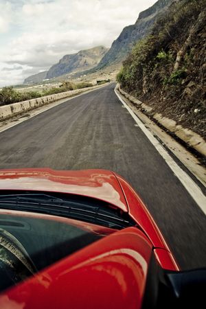 Driving at high speed by mountain road .の写真素材