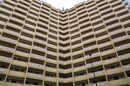 Angled building with a lot of apartmentsの写真素材