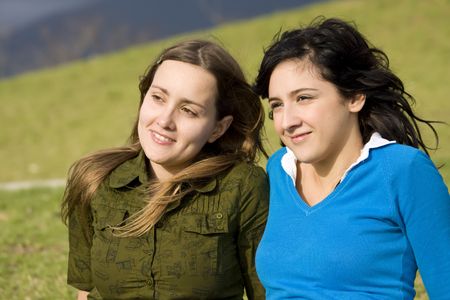 Two smiling girls in the parkの写真素材