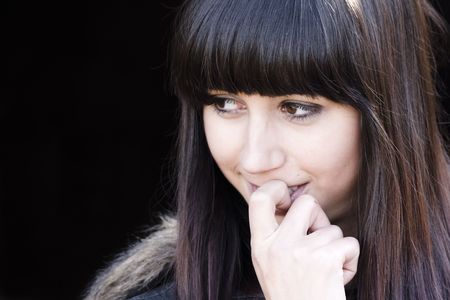 Closeup girl portrait against black backgroundの写真素材