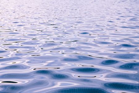 Blue water waves in swimming pool.の写真素材