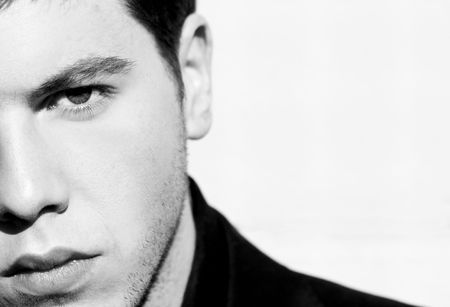 Unshaved handsome man portrait. Black and white isolated on white. 