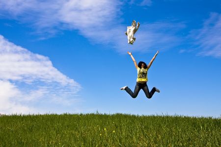 Happy woman throwing her jacket to the air.