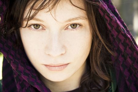 Beautiful woman covered by violet veil.の写真素材