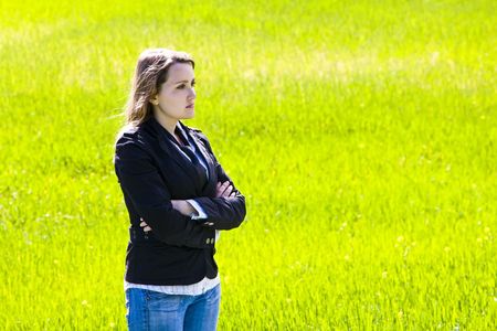 Businesswoman on spring green backgroundの写真素材