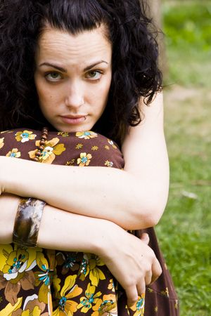 Young curly woman against green backgroundの写真素材