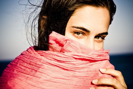 Shy beautiful green eyed woman behind veil.の写真素材