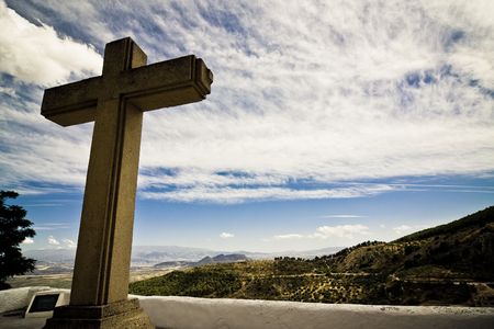 Christian cross in Mediterranean landscape, dramatically toned.の写真素材