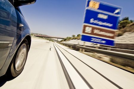 Road signs blurred due the vehicle high speed.の写真素材