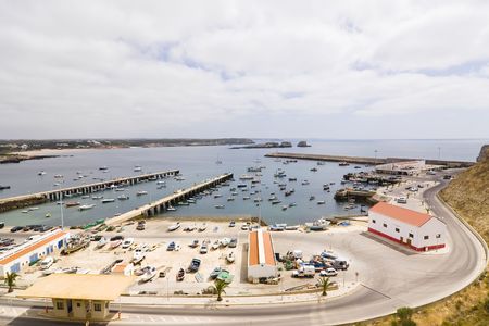 Port facility full of boats under cloudscapeの写真素材