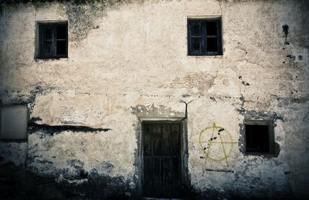 Old house facade, abandoned and grafted.