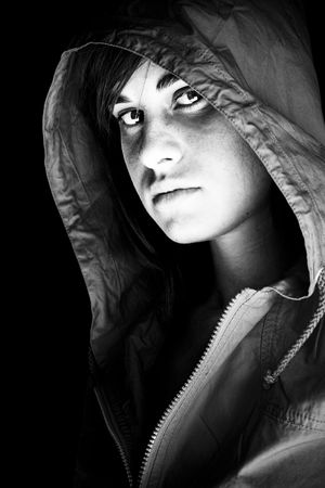 Young beauty protected with a cap from the dark.の写真素材