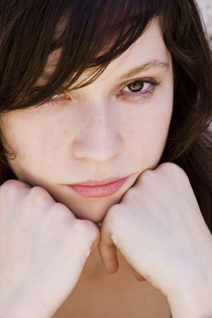 Sensual young woman portrait staring at camera.