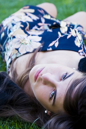 Young girl over the grassの写真素材