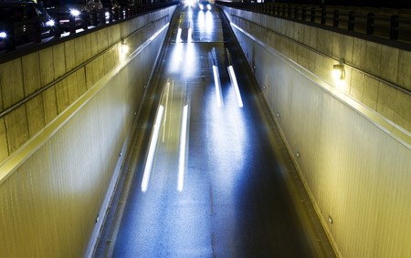 Long exposed lightbeams in urban street.の写真素材