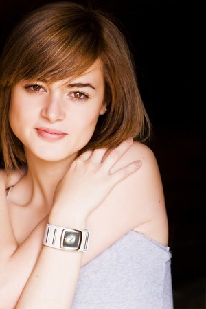 Beautiful blond woman embracing herselfの写真素材