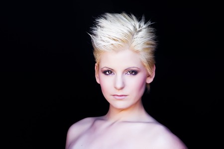 young beautiful blonde isolated on blackの写真素材