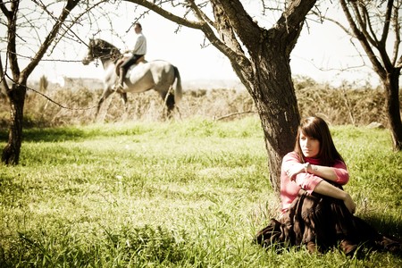 Rural scene with separated couple. Focus on woman.の写真素材