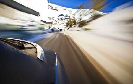 Driving at high speedover the snowの写真素材