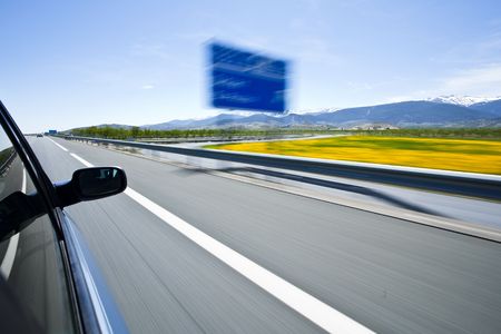 Driving at high speed under blue sky.の写真素材