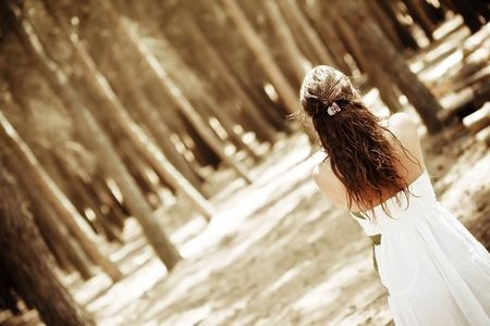 Young anonymous woman in the forestの写真素材