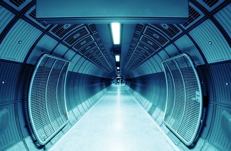 Cylindric tunnel for pedestrians, blue toned.の写真素材