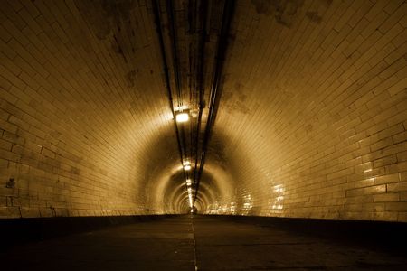 Creepy old tunnel below Thames riverの写真素材