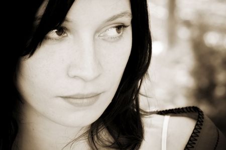 Young beautiful woman portrait, sepia toned.の写真素材