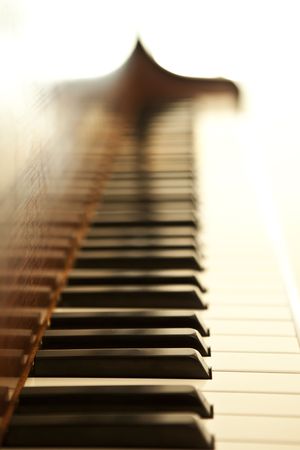 Piano side view with keys lost in the light.の写真素材
