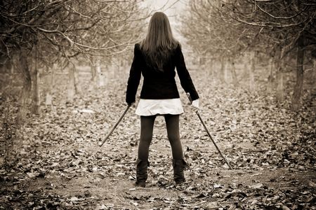 Young woman holding asian sword