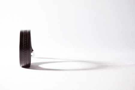 Belt and its shadow isolated on white.の写真素材