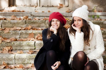 Two female friends staring at cameraの写真素材