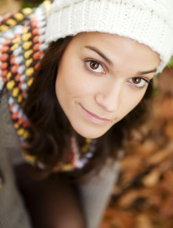 Young beautiful woman close portrait, autumn colors.の写真素材