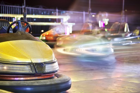 Bumper cars, ones parked and others in motionの写真素材