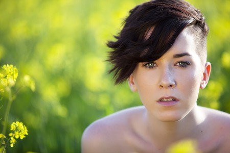 Young modern girl with no clothes on nature.の写真素材