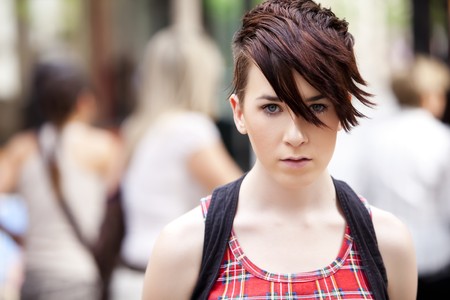 Young modern looking girl over urban backgroundの写真素材