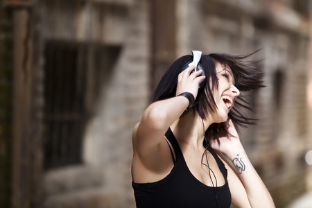 Young beautiful girl happy and dancingの写真素材