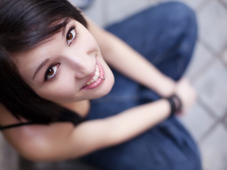 Friendly smile from a young pierced urban girl.の写真素材