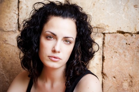 Green eyed beautiful woman with pierced lipの写真素材